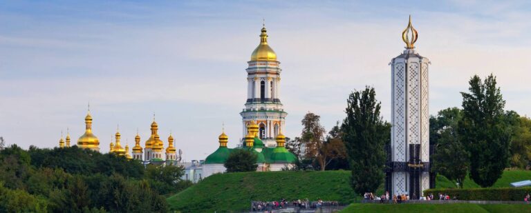 The article provides information about IVF in Ukraine. The accompanying image portrays a picturesque Ukrainian cityscape.
