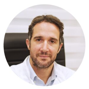 Drakopoulos Reproductive Medicine 1 Profile photo of an IVF specialist from Drakopoulos Reproductive Medicine. The doctor is wearing a white coat and sitting in an office chair; their face is blurred for privacy.